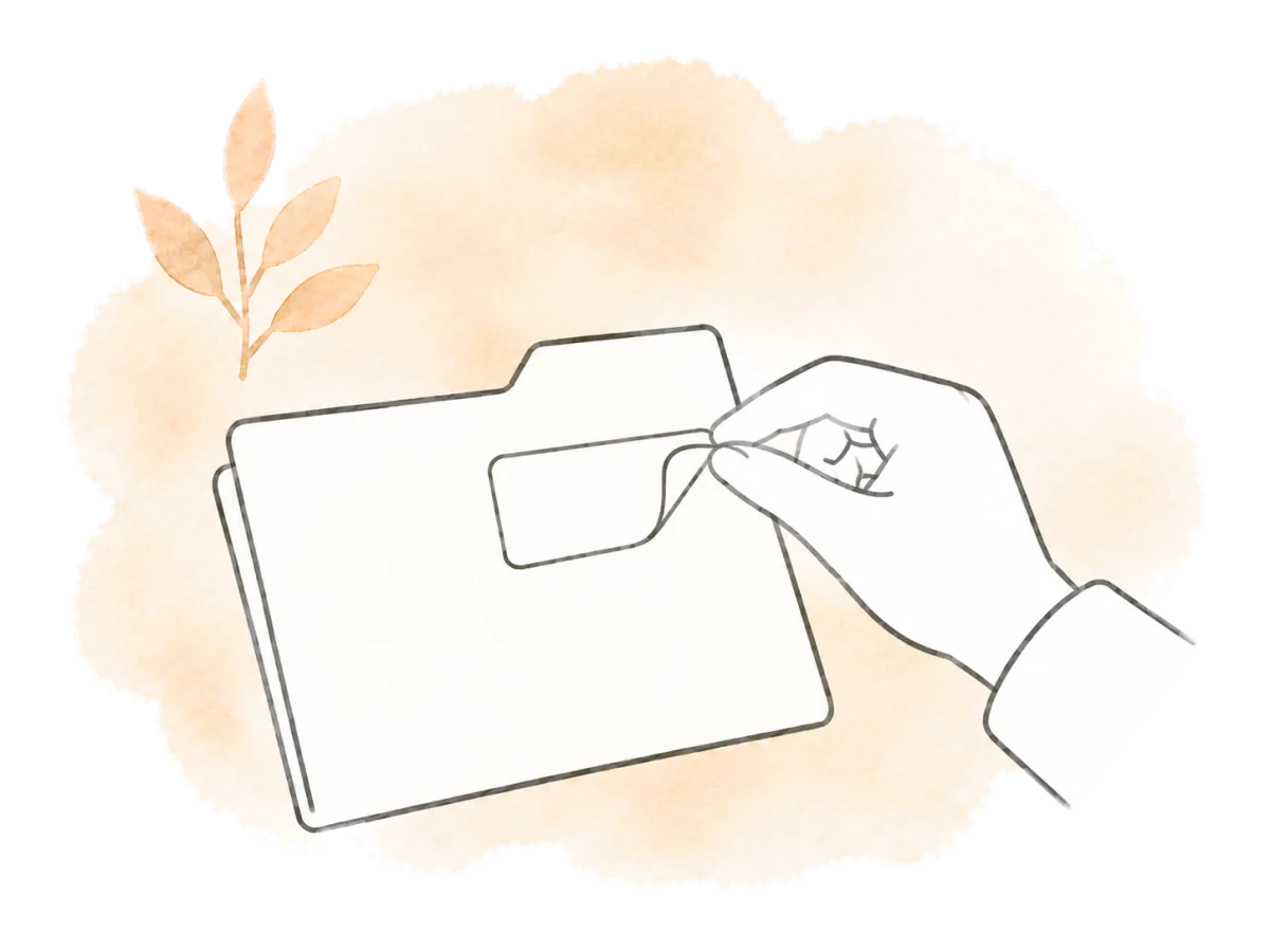 A hand peels a label from a closed folder to change its details.