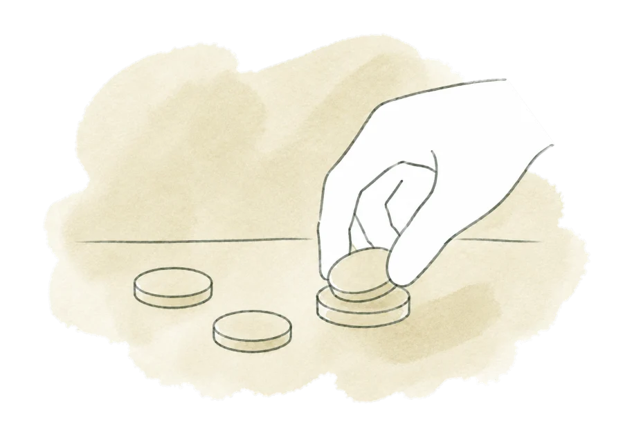 A hand gathers scattered coins into a single small stack.