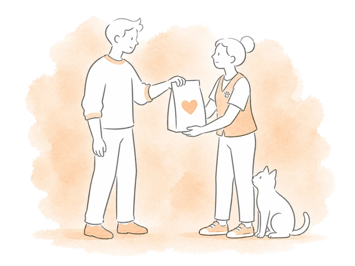A donor hands supplies to a rescue volunteer.