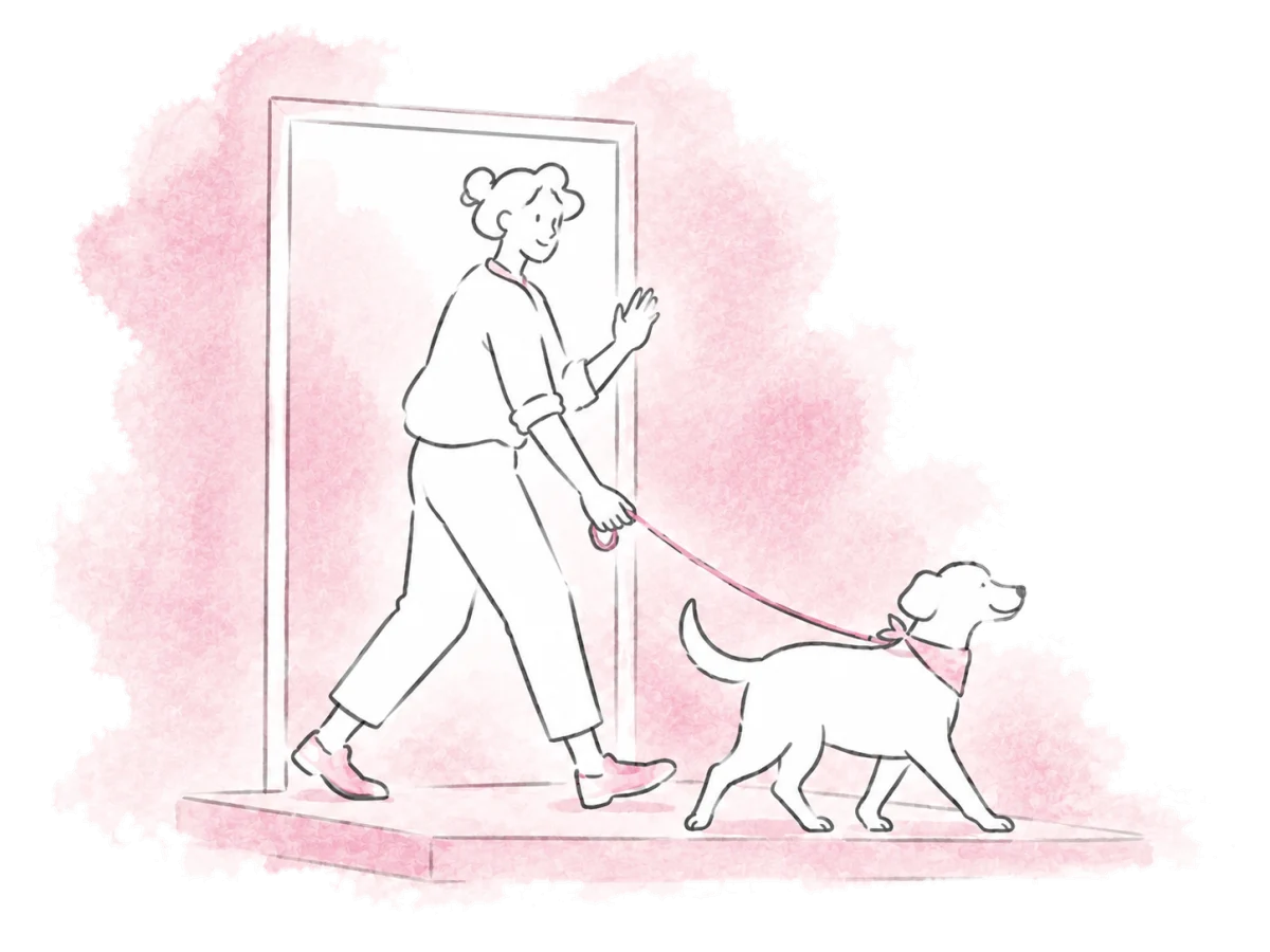An adopter leaves the shelter with a dog and waves goodbye.